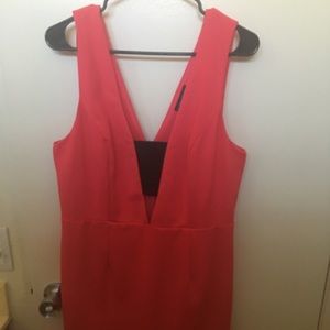 Red-orange cocktail dress with cutout